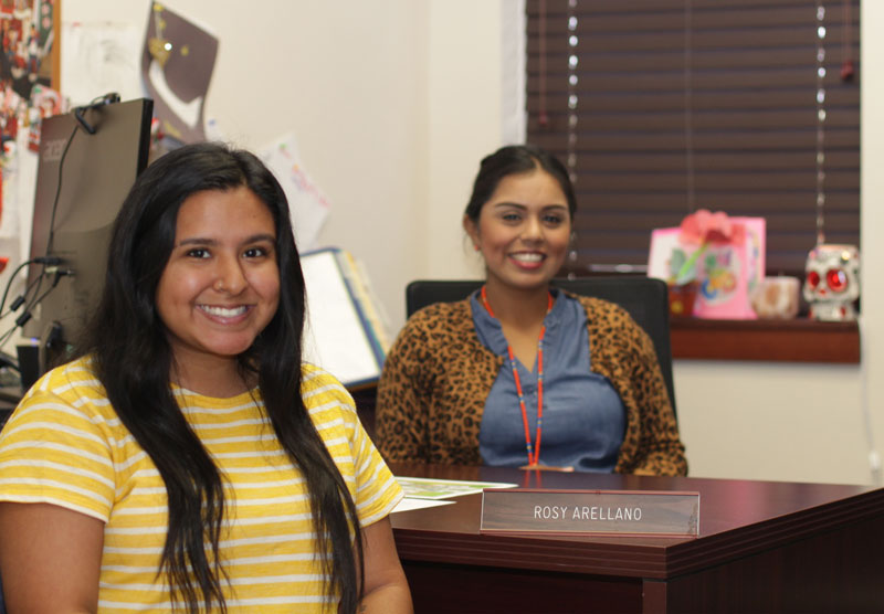 Student and advisor sitting in office