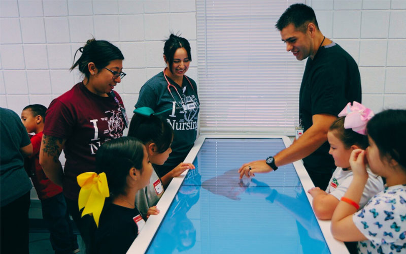 Crystal City students interact with the Anatomage Table at the Uvalde campus.