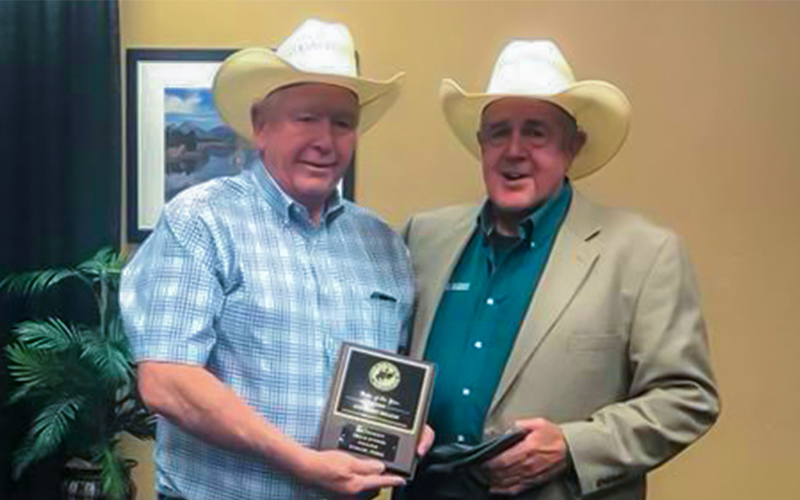 Photo: (l-r) SWTJC Rodeo Coach Roy Angermiller (left) accepts the award for Rodeo of the Year in the Southern Region from Roger Walters, (right) National Intercollegiate Rodeo Association Commissioner in Casper Wyoming.